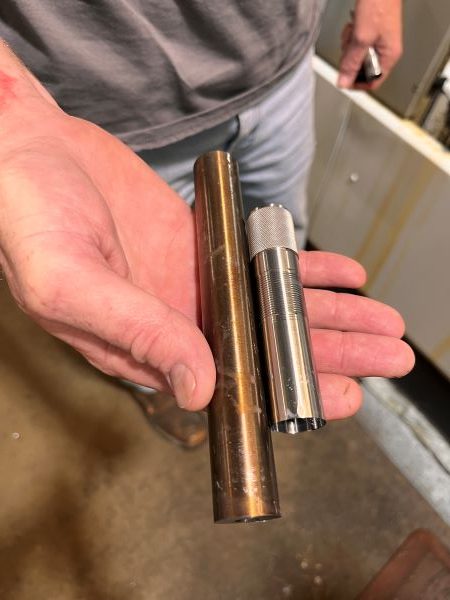 Trulock Makes Affordable Bespoke Chokes for Collegiate Competitors 10 Scott Trulock shows the raw stock on the left used to make their chokes.